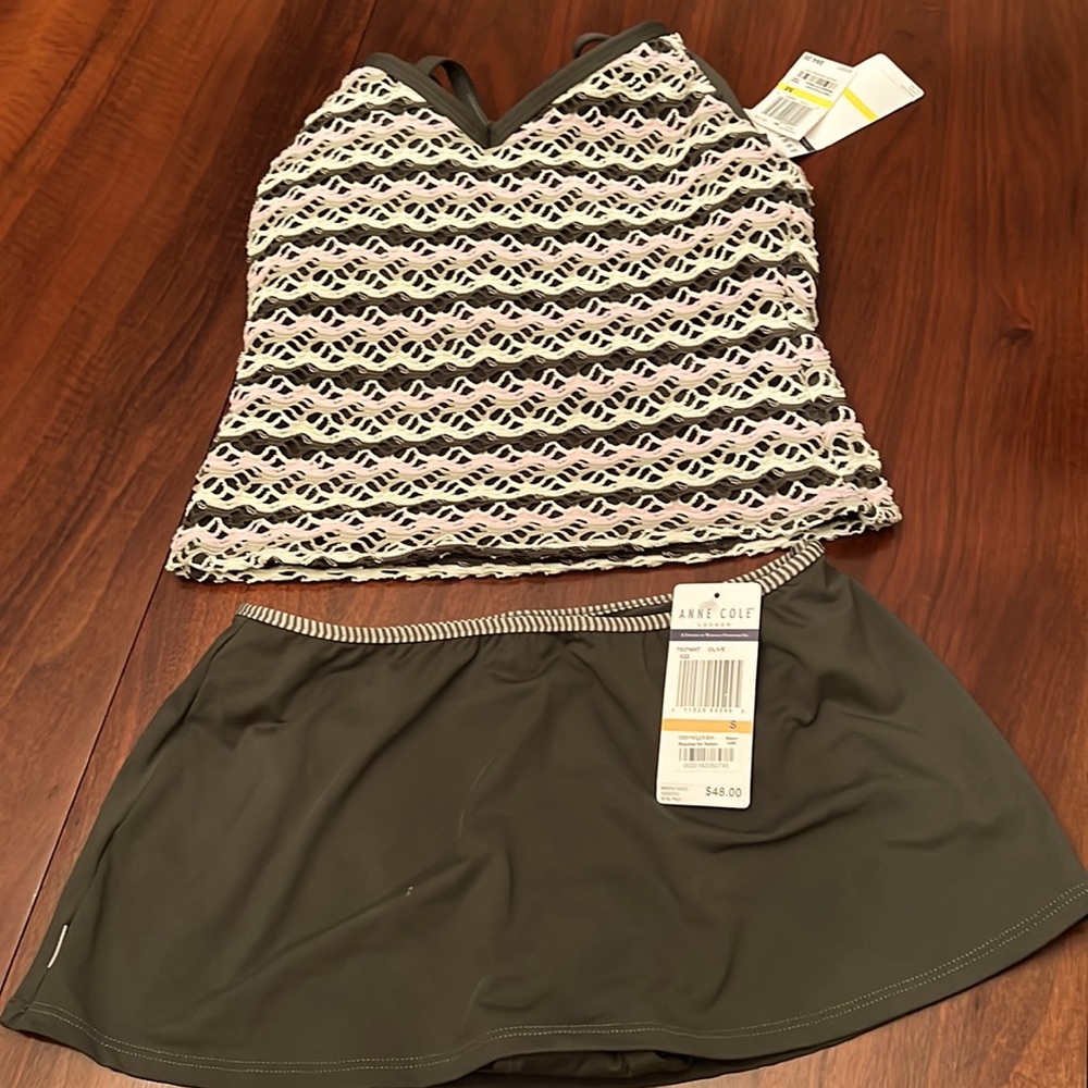 Never Worn Ann Cole Bathing Suit. Razor back top (M) with skort bottoms(S).